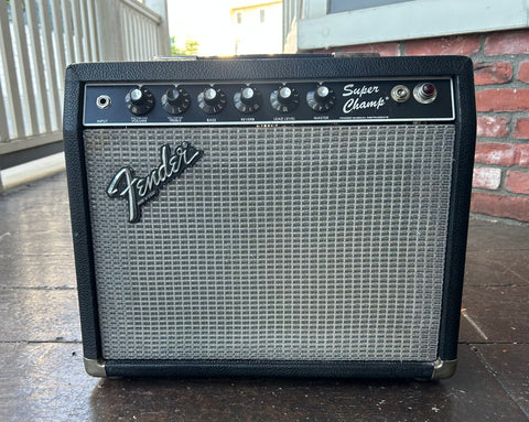 1982 Fender Super Champ amplifier, black tolext with black control plate, six knobs and grey grill cloth
