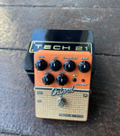 Tech 21 NYC Oxford, orange and tan pedal, with six black knob control, single button control button
