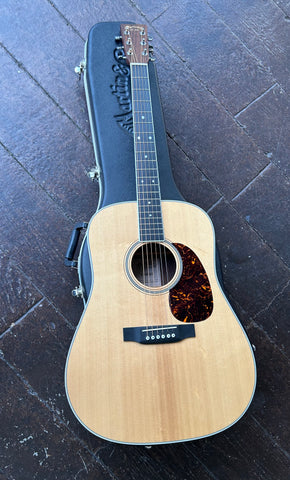 Top View Spruce top Martin guitar, with tortoise pick guard, ebony bridge, ebony fretboard, whit dot inlays, rosewood headstock, with Gold Martin script  