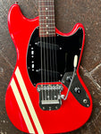 close up red body with metal tremolo black pick guard and pick ups