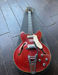 60's Vox Super Lynx Deluxe red finish hollow-body guitar with chrome hardware and rosewood pick-ups with block inlays and black headstock
