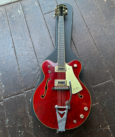 Red Chet Atkins Guitar, with metal bigsby gold ring, black pick ups with ebony fretboard
