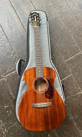 Guild M-120 Mahogany small body acoustic guitar with rosewood fretboard and brown headstock
