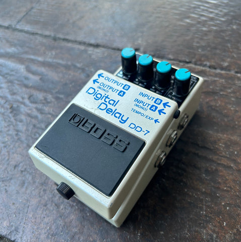 Boss pedal white with blue control buttons, black front