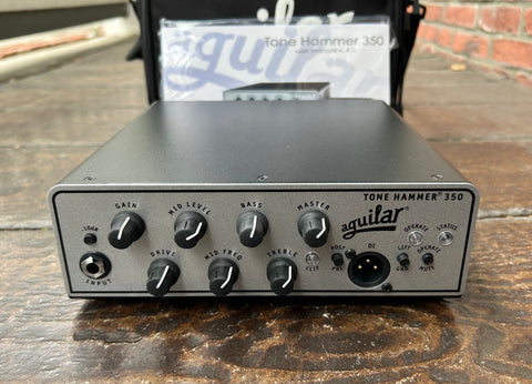 Aguilar Tone Hammer 350 Watt Bass Amp Head silver with seven control knobs