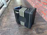 Black supro amp, front, white stripes  