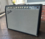 2004 Fender Custom Vibrolux Reverb amplifier, black tolex, grey grill cloth, black control panel, nine knob controls