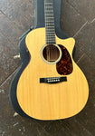 Close up: Martin spruce top with ebony bridge and tortoise pick guard,