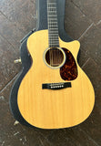 Close up: Martin spruce top with ebony bridge and tortoise pick guard,