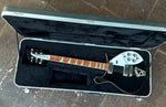 Front full view Rickenbacker in case black body, rosewood fretboardm Headstock white Rickenbacker truss cover