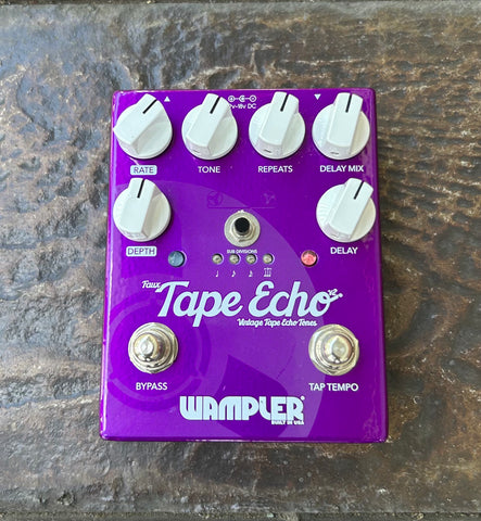 Wampler Faux tape echo purple guitar pedal, with six white control knobs and single button footswtch