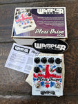 Wampler Plexi-Drive Deluxe white pedal with red and blue design, six black control knobs and two button footswitch