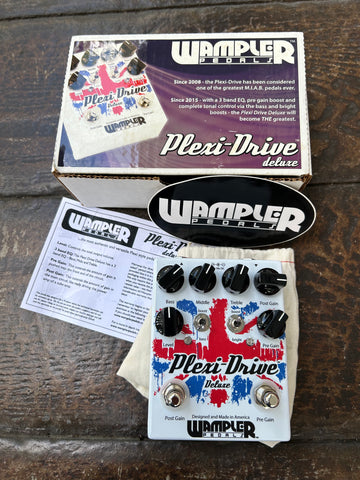 Wampler Plexi-Drive Deluxe white pedal with red and blue design, six black control knobs and two button footswitch