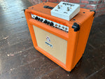 Side angle shot of Orange TH-30 with Footswitch placed on top