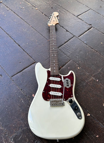 Squier white guitar with tortoise pickguard, white pick ups, metal control plate, rosewood neck