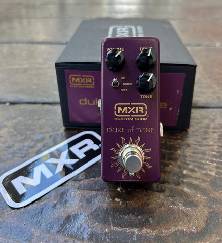 Purple MXR guitar effects pedal, three control knobs, single button footswitch, MXR branding.