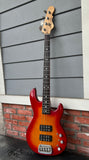 Front view bass red sunburst finish with black pick ups, with rosewood fretboard, natural headstock