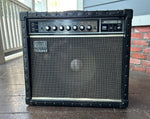 Roland Jazz Chorus-50 guitar amplifier, black tolex, grey grill cloth, dark grey control panel with seven knob controls