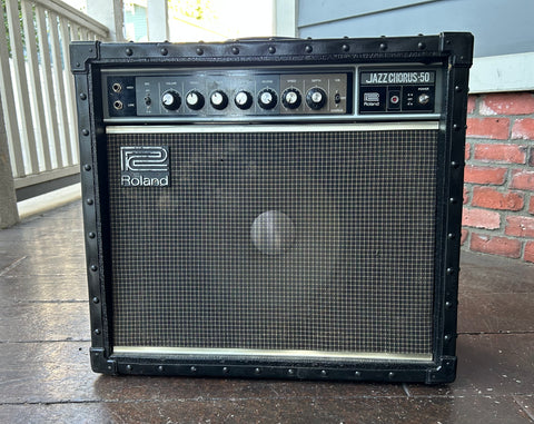 Roland Jazz Chorus-50 guitar amplifier, black tolex, grey grill cloth, dark grey control panel with seven knob controls