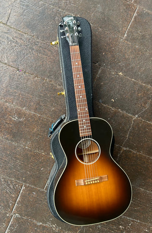 Sunburst acoustic guitar, rosewood bridge, rosewood fretboard with pearl dot inlays and black headstock, chrome tuners