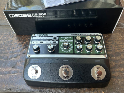 Boss RE-202 Space Echo effect pedal, three footswitch controls and nine knobs