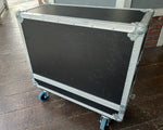Black and silver flight case on wheels outdoors