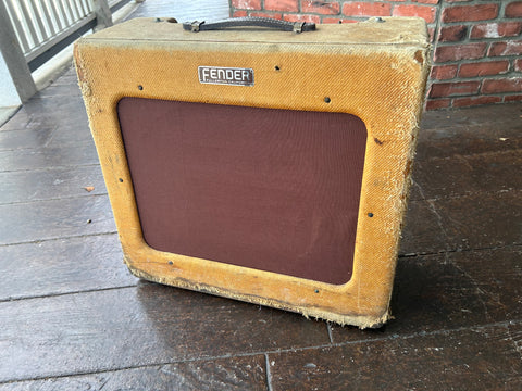 Tweed Amplifier with brown cloth front, Fender badge with leather handle 