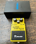 Yellow Boss Super Overdrive SD-1W guitar effects pedal with Boss packaging.