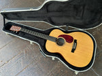 Spruce top martin, with red tortoise pick guard, dark wood fretboard, martin wood headstock