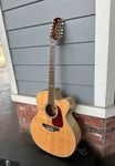 FUll shot of Takamine 12-String GJ72CE on incuded hardshell case
