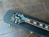 Headstock closeup of 1999 DeArmond Guild X155