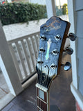 Headstock in semi profile for 1999 DeArmond Guild X155