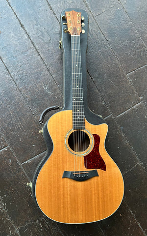 1996 Taylor Custom
Employee Custom Built, spruce top, rosewood neck and fretboard with rosewood neck