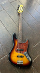 Sunburst Squier Jazz bass with red tortoise pick guard three controll knobs, rosewood bridge, dot inlays, maple headtock, 