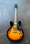 Sunburst Epiphone hollowbody with two chrome pick ups, rosewood fretboard, block inlays, four knobs, tunematic with bridge