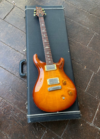 Top View, PRS electric guitar honey burst, with chome pick ups, rosewood fretboard with bird inlays, rosewood headstock with tuners