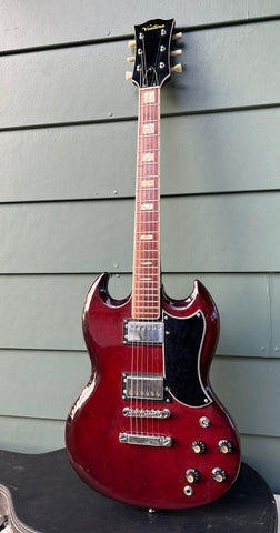 Ventura dark burgundy, with two humbucker chrome pick ups, black SG style pick guard, chrome hardware, rosewood neck with block inlays, Black headstock, Ventura script in gold, green button tuners