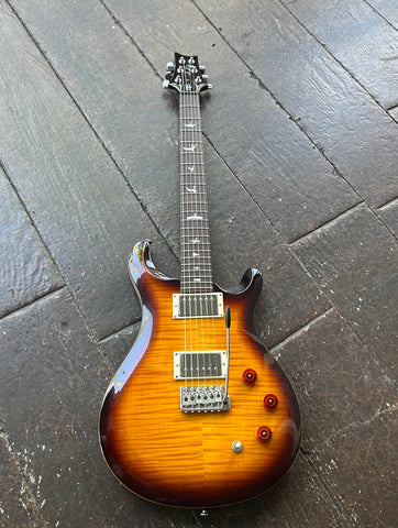 PRS SE David Grissom sunburst maple top, mahogany back, 22-fret, 25” scale length mahogany neck with rosewood fretboard, and bird or moon inlays.