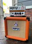 Orange amplifier head , white with black knobs, with Orange cabinet wheat grill cloth