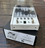 White pedal, two metal button with effect option, five grey fader slider switches, on box, model  listed CXM1978