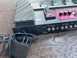 close up of Boss black adapter and back view of phantom and mono outputs