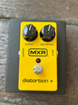 MXR Distortion Plus yellow guitar pedal, two black control knobs, single button footswitch