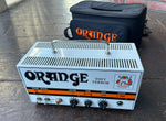 Orange Tiny Terror white guitar head, with three control knobs 
