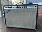 1976 Fender Vibrolux Reverb amplifier, black tolex, grey grill cloth and silver control panel, with nine control knobs