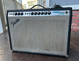 1976 Fender Vibrolux Reverb amplifier, black tolex, grey grill cloth and silver control panel, with nine control knobs