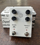 White Milkman F-stop tremolo and reverb pedal, four black control knobs, two button footswitch 