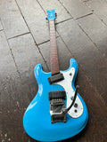 Top view Morales surf guitar, light blue with white pick guard, with black pick ups, rosewood fret board with dot inlays