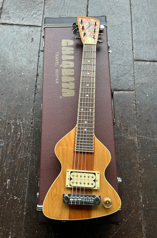 Top view mini travel electric guitar, natural finish wood, tan humbucker, rosewood fretboard with dot inlays, brown headstock with Chiquita script