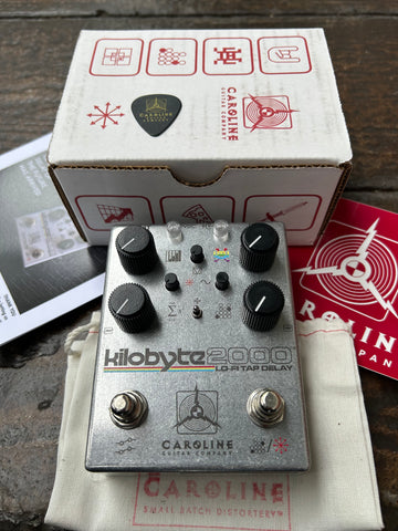 Caroline Kilobyte 2000 Lo-Fi Tap Delay silver guitar pedal with four control knobs
