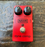 MXR Dyna Comp Compressor red guitar pedal with two black knobs, and single button footswitch